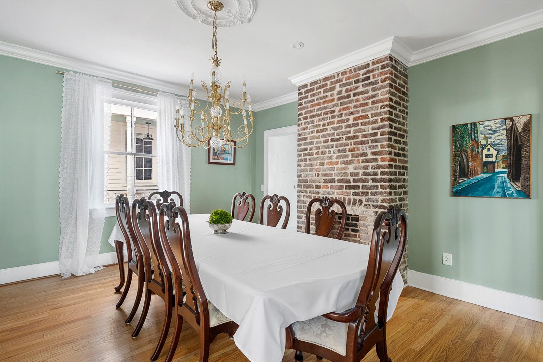 12 Percy Street, formal dining room with exposed brick fireplace
